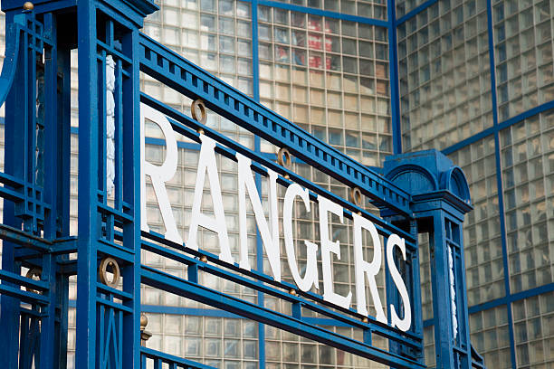 Ibrox Stadium, Glasgow "Glasgow, UK - March 28, 2013: The Rangers Football Club Ltd. sign over the gates between the Main Stand and the Broomloan Road Family Stand at Ibrox Stadium, Glasgow, the home ground of Rangers Football Club." ibrox stock pictures, royalty-free photos & images