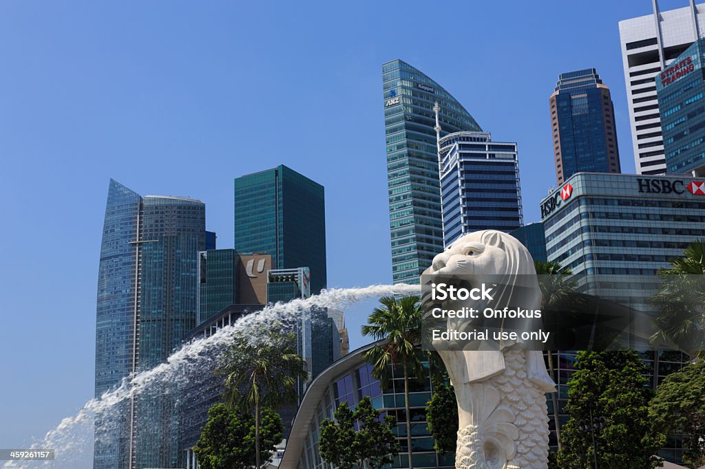 Merlion Statue in Singapore Marina Bay Singapore, Singapore - March 19, 2013: A view to Merilon Statue at Marina Bay and Singapore Skyline in background at day time. Architecture Stock Photo