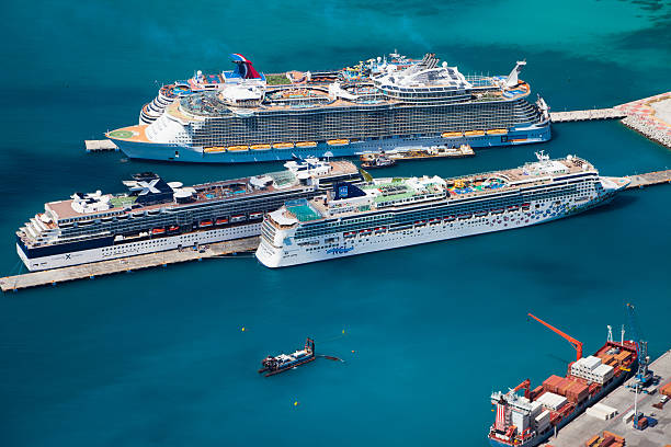 cruise ships at the dock in Philipsburg, St. Maarten Philipsburg, St. Maarten, Dutch West Indies - October 24, 2012: aerial view of four cruise ships at the dock: Norwegian Gem; Celebrity Summit, Oasis of the Seas and Carnival Dream saint martin caribbean stock pictures, royalty-free photos & images