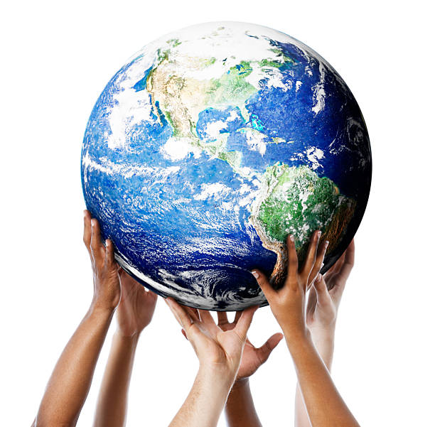 istock Globe of Earth being held up by multiple hands 459262585