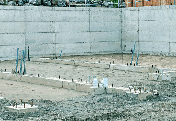 istock Concrete foundation and walls of house under construction 459266607