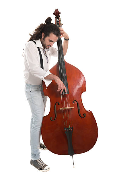 atractivo músico de jazz tocando contrabajo aislado en blanco - isolated on white studio shot guitar young men fotografías e imágenes de stock