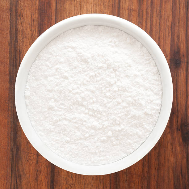Powdered sugar Top view of white bowl full of powder sugar powdered sugar stock pictures, royalty-free photos & images