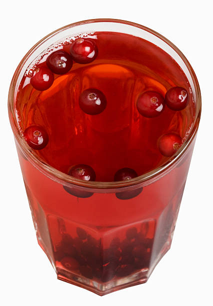 Cranberry fruit drink Red cranberry fruit drink isolated on the white background marshwort stock pictures, royalty-free photos & images