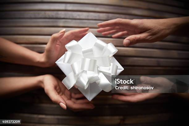 Giving Christmas Present Stock Photo - Download Image Now - Celebration, Christmas, Christmas Paper