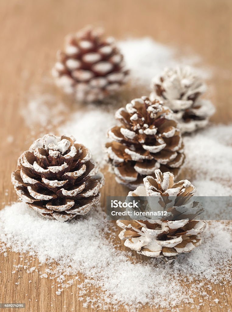 Christmas decoration with pine cones on wooden background Brown Stock Photo