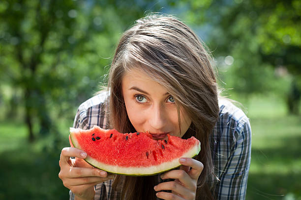 istock woman and watermelon 459279007