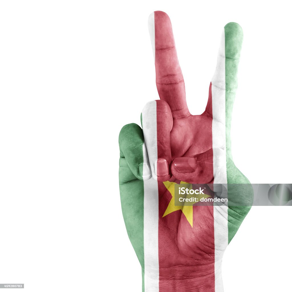 Suriname Flag On Victory Hand Suriname flag  on victory hand with a white background. Achievement Stock Photo