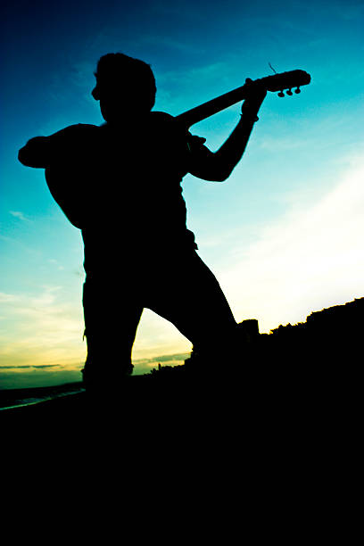 man who plays the guitar on sunset