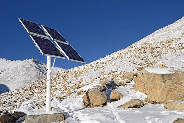 solarcells on a winter with snow mountain in Ladakh, India