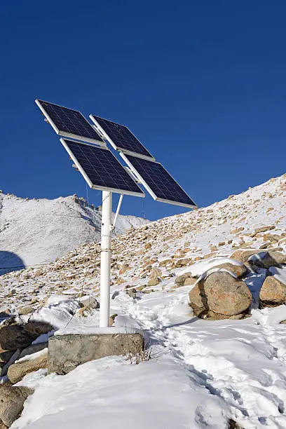 solarcells on a winter with snow mountain in Ladakh, India