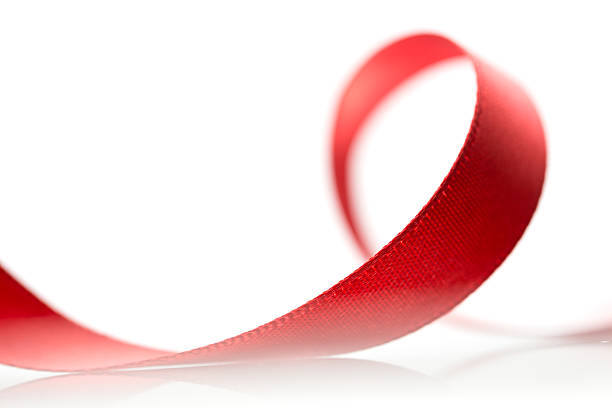 istock Beautiful fabric red ribbon on white background 459289249