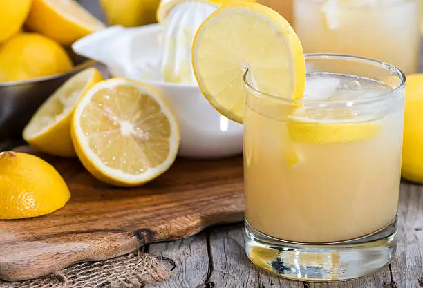 Photo of Arrangement of glass with fresh lemonade with ingredients