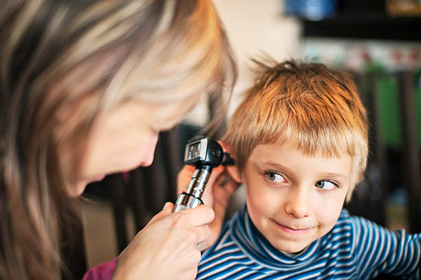 istock Home visit medical ear examination 459292959