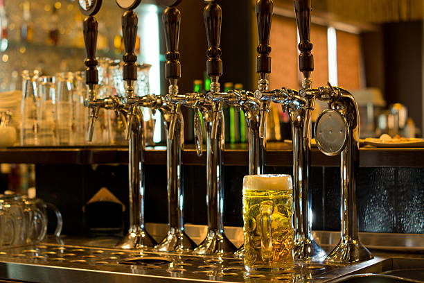 istock Tankard with beer taps in a pub 459293911