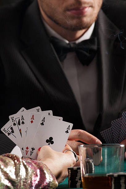 istock Aces and kings in womans hands 459308021