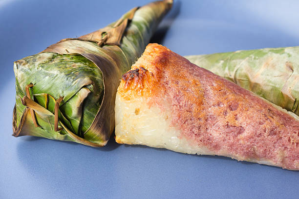 Sticky rice roast , wrapped in banana leaves. stock photo