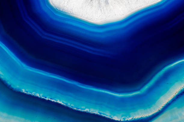 Background  slice of  blue agate crystal A background of slice of  blue agate crystal agate photos stock pictures, royalty-free photos & images