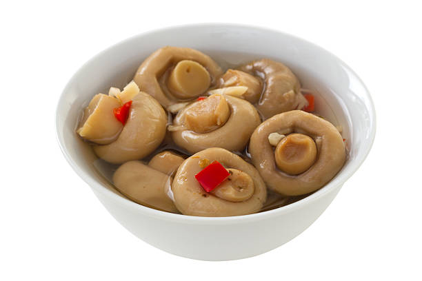 istock marinated mushrooms with pepper in white bowl 459316825