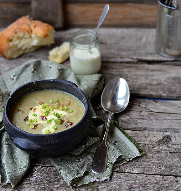 istock Black bowl filled with bean soup and sour cream 459317575