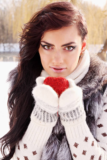 istock woman holding a red heart 459321367