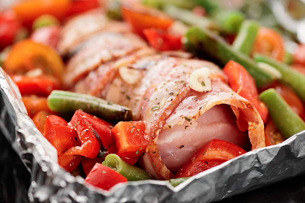 istock Chicken breast wrapped in bacon prior to baking 459329843