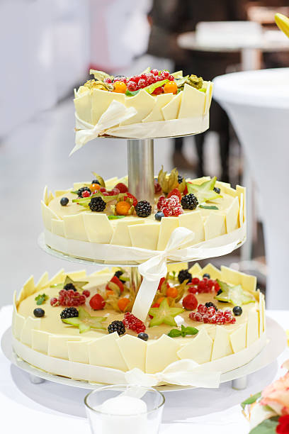 istock Wedding cake decorated fresh fruits and berries 459332425
