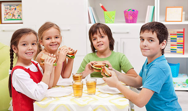 istock Kids having a snack in their room 459341769