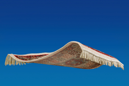 Flying magic carpet set against clear blue sky