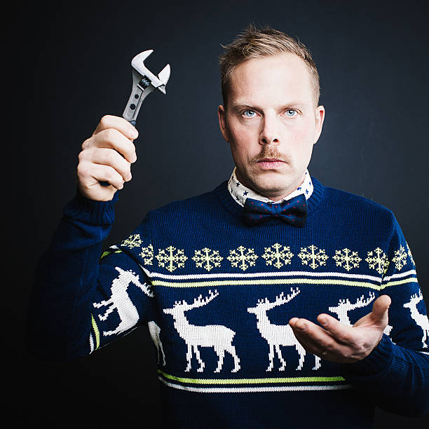 Upset man with tool Upset man with tool christmas nerd sweater cardigan stock pictures, royalty-free photos & images