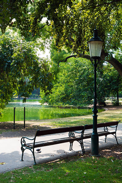 Bench and lamppost at Stadtpark in Vienna, Austria.
