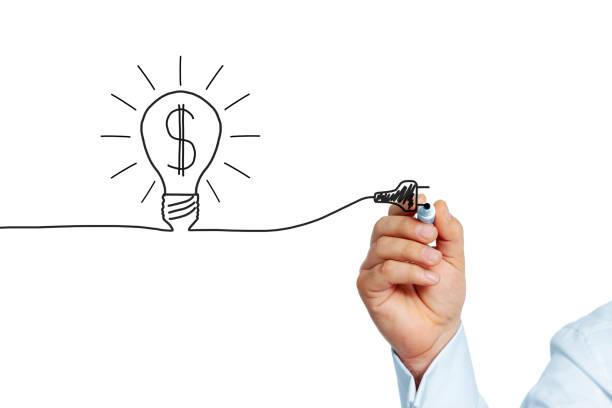 istock Businessman draws Dollar sign inside symbolic lightbulb 459346907