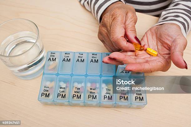 Taking Pills Stock Photo - Download Image Now - Medicine, Variation, Senior Adult