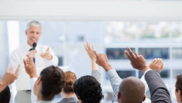 istock Business team raise their arms while watching a mature businessm 459354857