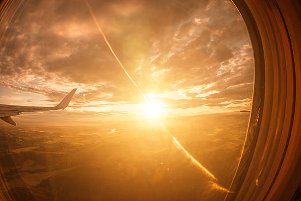 istock Sunlight from the porthole on airplane 459358253