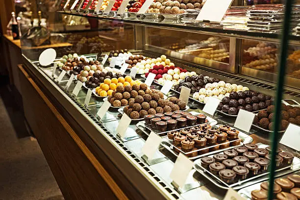 This is image of of different chocolate truffles in store. Side view. Selective focus.