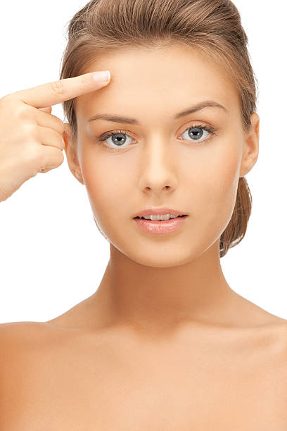 istock beautiful woman touching her forehead 459363147