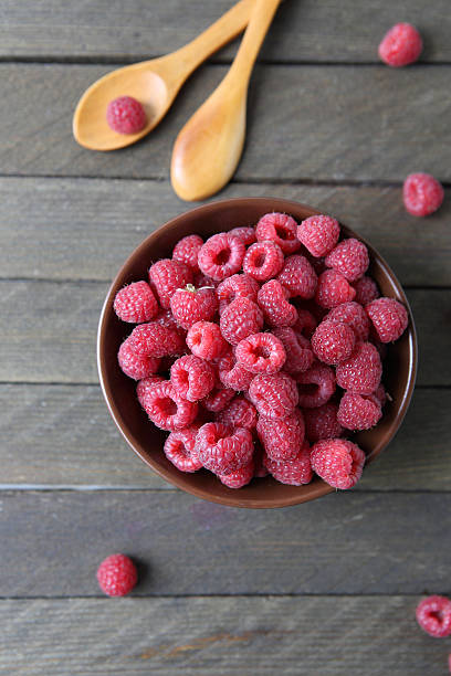 istock tasty and ripe red raspberries top view 459366253