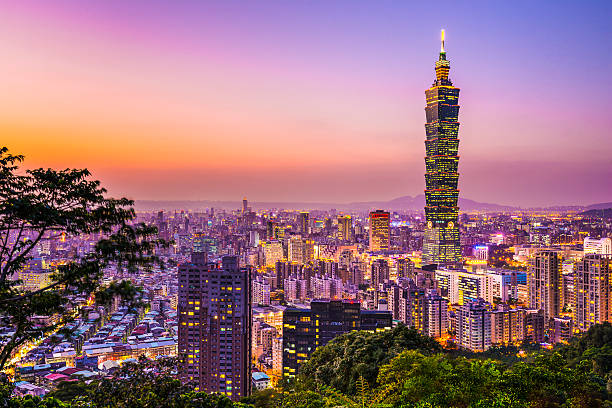 Skyline view of Taipei glowing in the sunset light Modern office buildings in Taipei, Taiwan at dusk. taiwan stock pictures, royalty-free photos & images