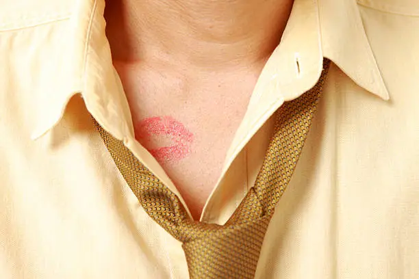 man with lipstick mark.