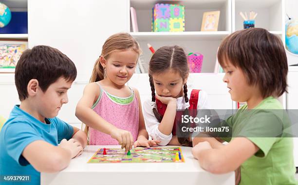 Children Playing Board Game Stock Photo - Download Image Now - Child, Boys, Playing