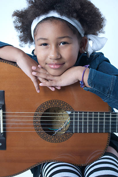 istock girl with a guitar 459381445