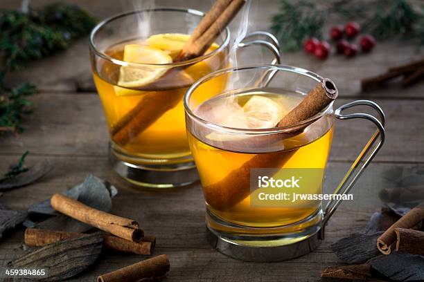 Two Hot Toddy Cocktail Drinks With Cinnamon And Lemmon Stock Photo - Download Image Now