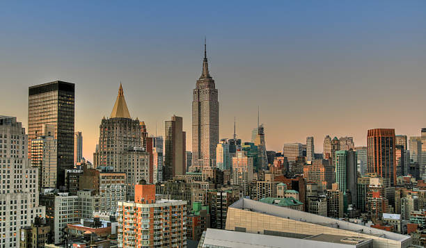 istock Empire State building at sunset and Manhattan Skyline, New York. 459385489