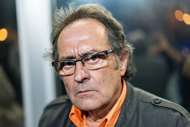 istock Serious adult man with eyeglasses looking into camera 459385995