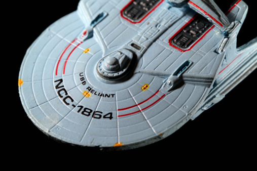 Vancouver, Canada - November 9, 2011: A model of the USS Reliant from the Star Trek film The Wrath of Khan, on a black background. The model was made by the Micro Machines division of the Galoob toy company.