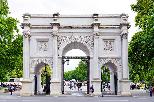 London, United Kingdom - August 7, 2011: Marble Arch, designed in 1828 by John Nash and modeled after the Arch of Constantine in Rome, was originally erected near Buckingham Palace, but was moved to its present location on the northern side of Hyde Park in 1855.