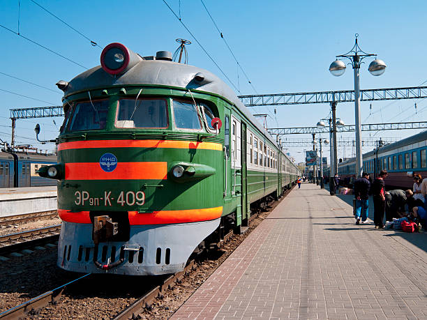 Yaroslavl, Russia - May 5, 2006: Train stopped at Yaroslavl station on the trans-siberian route through Russia. People can be seen beside the train.