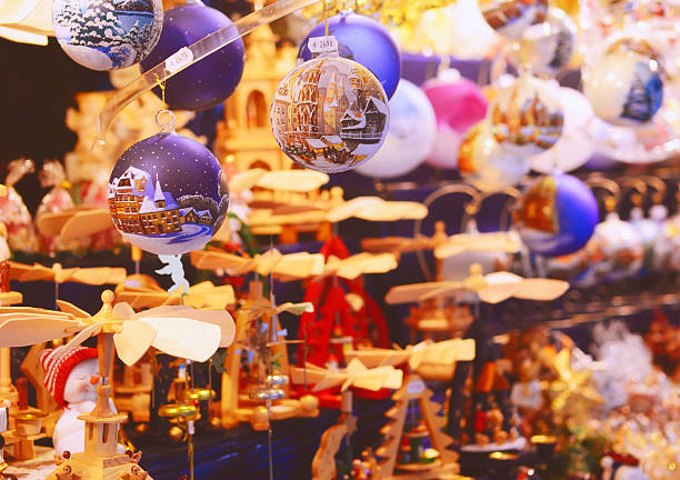 Nuremberg, Germany - November 25, 2011: Hand-painted Christmas balls and Christmas pyramids at display at a Nuremberger Chriskindlesmarkt stall.
