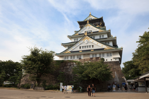 Osaka, Japan - September 11, 2010 : People at Osaka Castle. It is the most famous castle in Japan. It is located in Chuo-ku, Osaka, Japan. The castle is open to the public and it is a main tourist attraction in Osaka, Japan.
